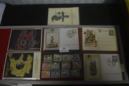 A small Third Reich propaganda and postal ephemera group, including illustrated postcards, Reich-