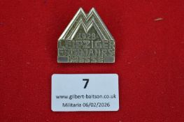 German Leipzig Spring Fair badge, dated 1928, die-struck example with stylised “M” motif and