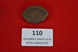 German Red Cross commemorative badge, shield-shaped bronze issue depicting architectural building,