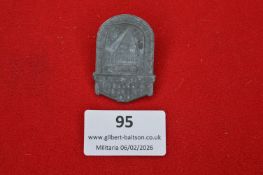 German regional festival badge, arched-top plaque form depicting historic building, inscribed “20.