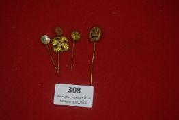 Four German lapel stick pins, a small group of gilt and metal examples with floral and heraldic
