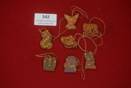 A group of German WHW ceramic hanging plaques, zodiac and symbolic themed examples including named