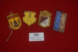 A small group of German cardboard civic and club badges, including shield and rectangular examples