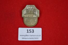 German shooting association commemorative tinnie, shield-shaped, depicting architectural and town