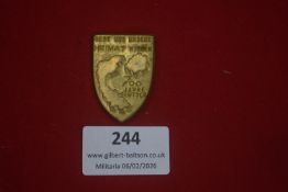 German patriotic or commemorative badge, shield-shaped, inscribed “Gebt uns unsere Heimat wieder –