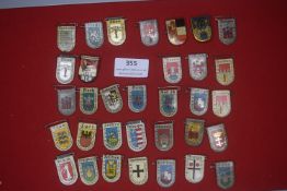 A large group of German enamelled heraldic tinnies, shield-shaped, depicting towns and regions