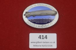 Third Reich Nord- u. Südamerika Jubiläumsfahrt 1933 Zeppelin badge, silvered airship on blue