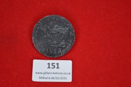 German Third Reich-era commemorative tinnie, circular form with profile head wearing side cap and