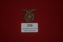 German NSDAP membership badge, eagle and wreath pattern with central swastika. Darkened metal