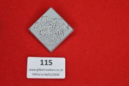 German nationalist commemorative badge, diamond-shaped grey metal issue with Gothic script