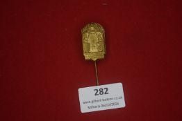 German commemorative stick pin, gilt metal, arched form with symbolic figures and dated inscription,