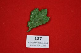 German oak leaf badge, leaf-shaped form in green enamel or painted finish. Rear pin fitting. Minor