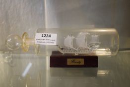 Glass Ship in Bottle on Stand “Bounty”