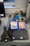 PlayStation 2 Console with Games, Controller, and Guitar Hero