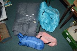 Camping Gear Including Sleeping Bags and an Inflatable Cushion Seat