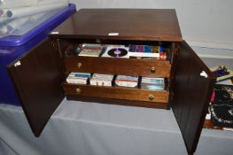 Cabinet Containing CDs and Music Cassette Tapes