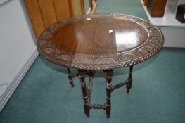Carved Oak Oval Drop Leaf Table