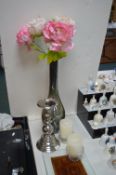 Candlesticks, and a Vase with Artificial Flowers