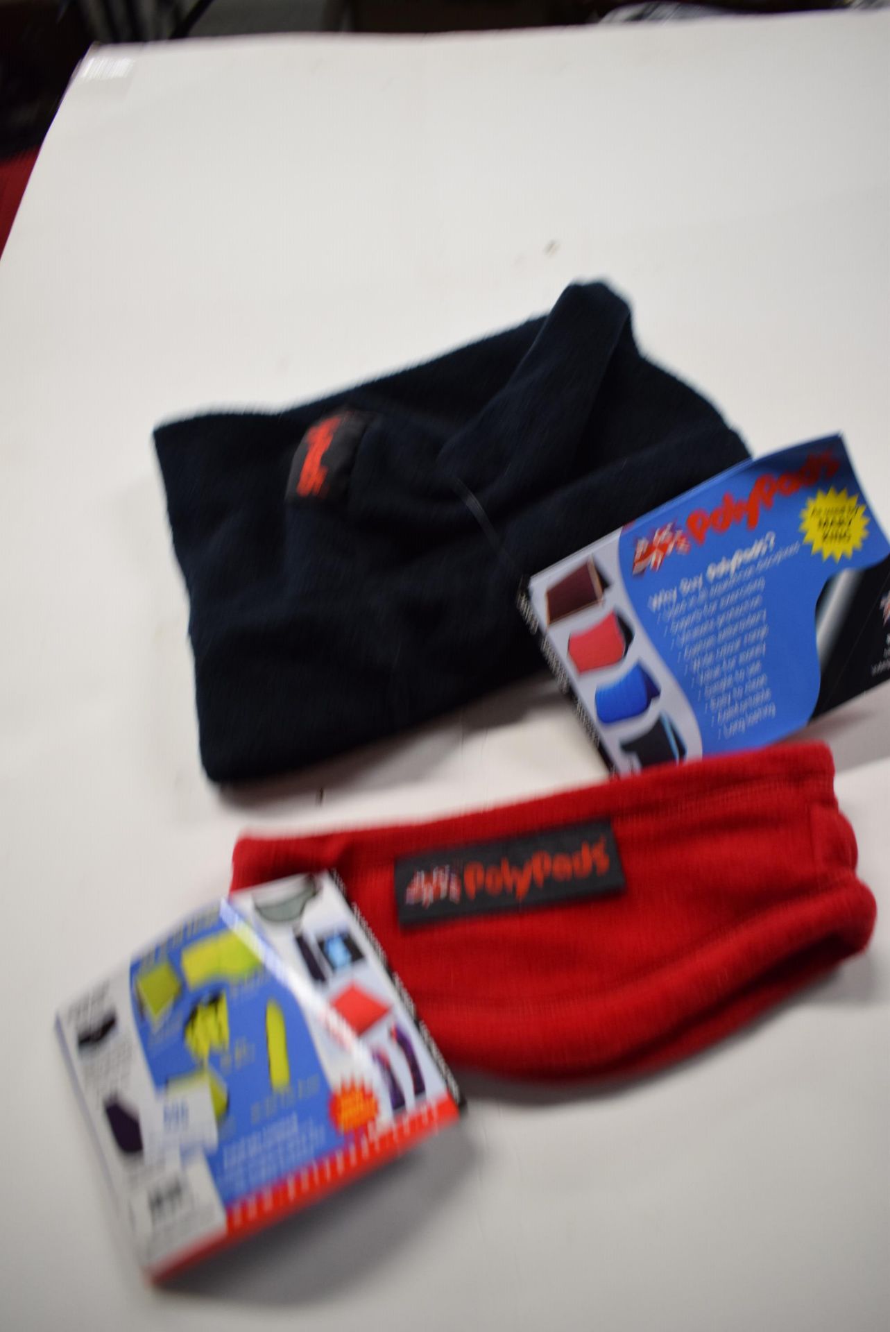 1x Poly Pads Warm Rider in Red Size: S, and 1x Poly Pads Neck Wrap