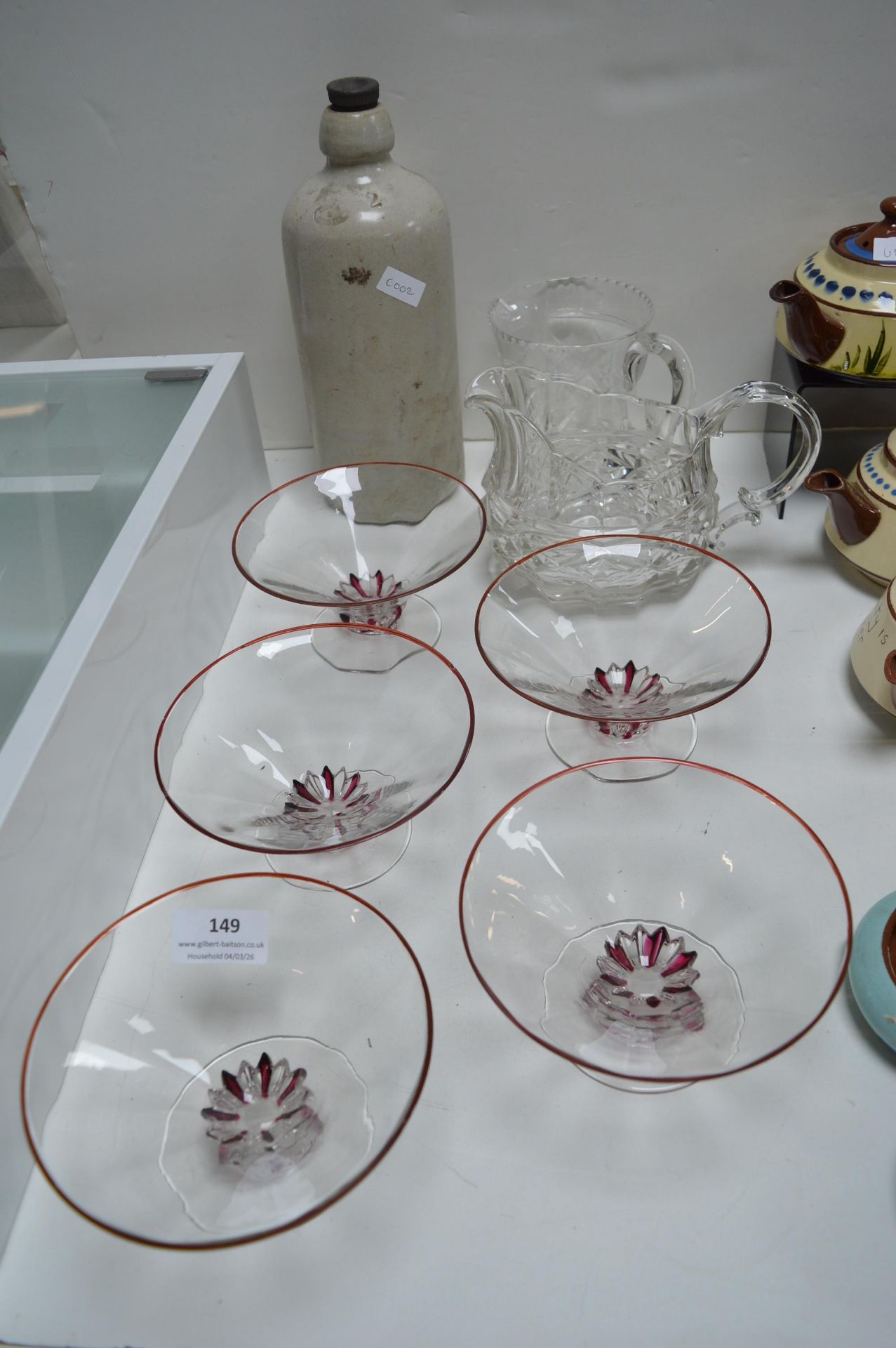 Glass Dishes, Jugs, and a Stoneware Bottle