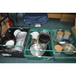 Assorted Kitchenware Including Bowls, Pans, and Storage Tins