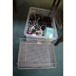 Storage Box Containing Electrical Cables, and a Stationary Rack