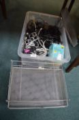 Storage Box Containing Electrical Cables, and a Stationary Rack