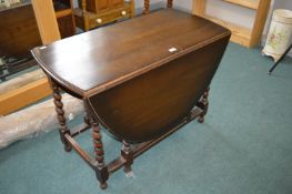 Dark Oak Oval Drop Leaf Dining Table with Barley Twist Supports