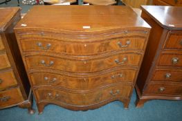 Serpentine Front Four Drawer Chest with Walnut Veneer