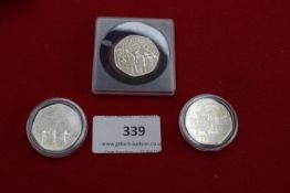 Small group of commemorative 50p coins including 1918 Armistice type and VC issue, in capsules.
