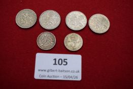 Four Elizabeth II sixpences (1956, 1957, 1965, 1967), together with a George V threepence dated 1920
