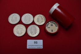Five Elizabeth II halfcrowns, dated 1967, with shield reverse; together with a red plastic coin tube
