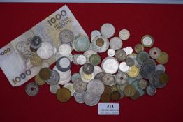 Mixed world coin collection in container, including various European issues and a Portuguese 1000