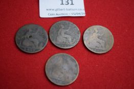 Four Victorian pennies including one holed example and others heavily worn (one dated 1873 visible).