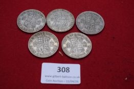 Group of George VI silver halfcrowns, including 1938, 1941, 1942, 1944 and another example. Fine