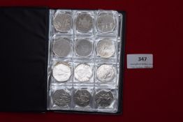 Album of UK commemorative 50p coins including Olympic, Beatrix Potter and other types, mixed dates