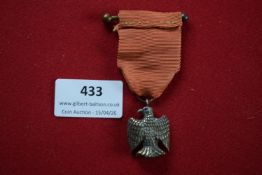 French Second Empire-style eagle suspension badge/medal, bronze, with ribbon and imperial eagle