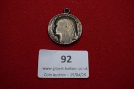 Art Deco style silver pendant medal. Female profile in classical Egyptian style with suspension
