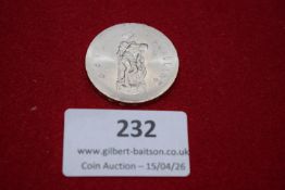 Modern commemorative medallion. Base metal medallion depicting a male portrait; reverse with