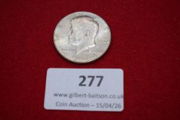 United States silver Half Dollar, 1964, Kennedy type. Extremely fine with light toning.