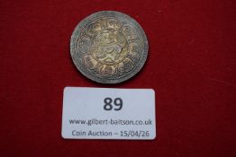 Tibet silver tangka. Struck with lion device within ornate script border.