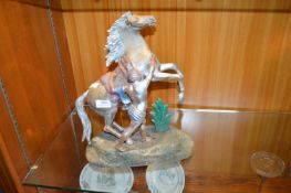 Metal Sculpture of a Boy and a Horse
