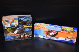 Hot Wheel Basic Track Pack, and a Monster Jam 4pc Megladon Monster Dirt Set
