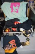 Aluminium Flight Case Containing Rock T-Shirts, Mugs, Fender Belt Buckle, and a Beatles Alarm Clock