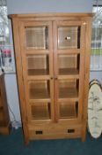 Ercol Glazed Cabinet with Bevelled Edge Glass and Lower Drawer