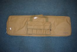 Nuprol tan padded rifle slip with full-length zip, carry handles and external pocket for accessories