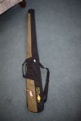 Buffalo River green and black padded rifle slip with carry handles and shoulder strap.
