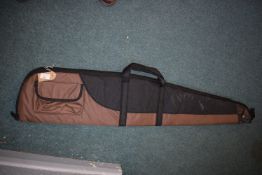 Two-tone brown and black padded rifle slip with carry handles and external pocket.