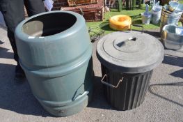 Green Plastic Garden Water Butt and a Dustbin
