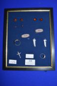 Display Frame Containing Silver Brooches, Pendants, Ring, and Amber Earrings ~32g total